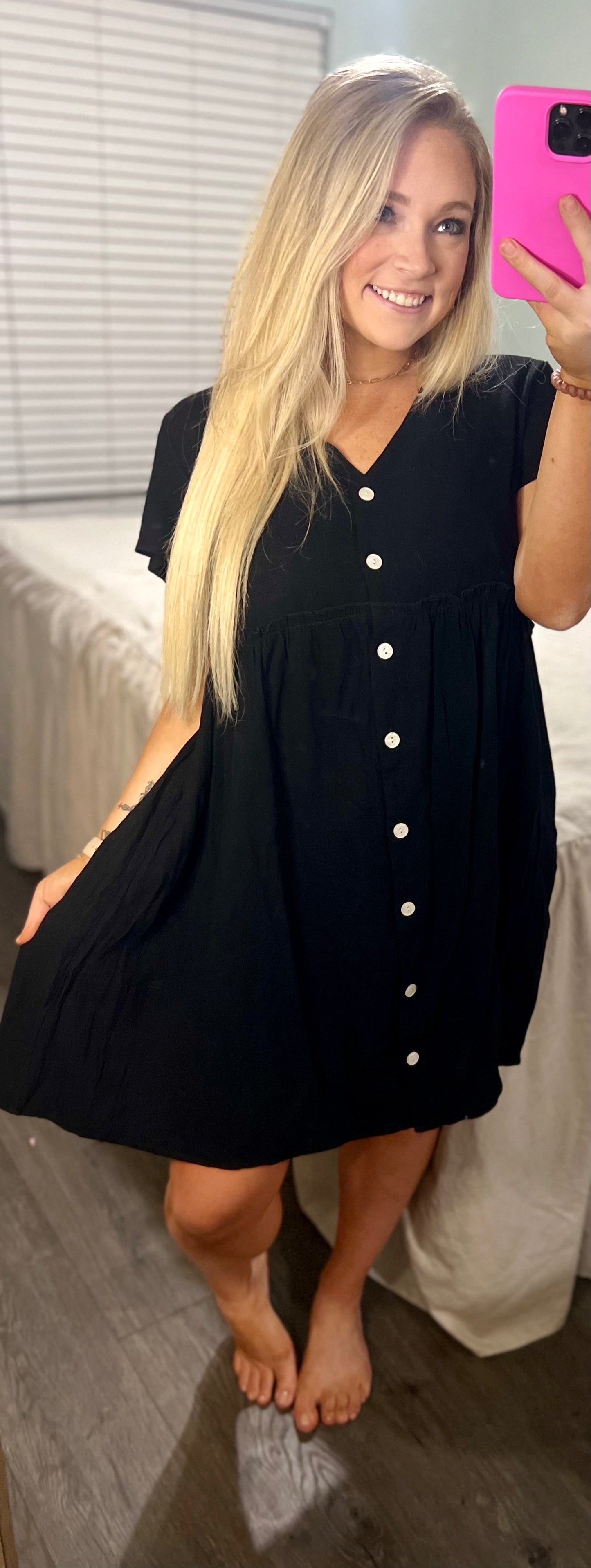 Show off black buttoned dress