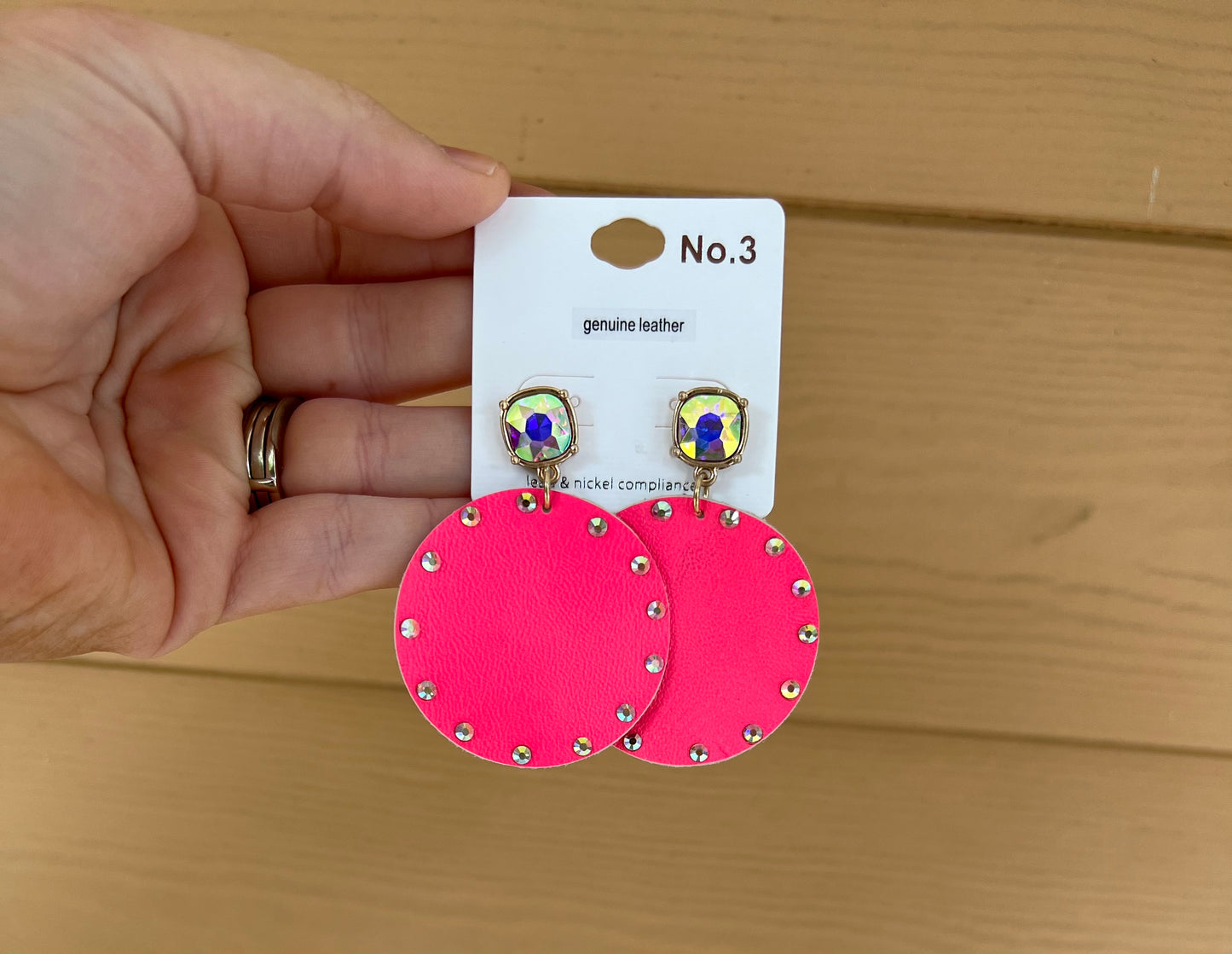 Iridescent trimmed circle earrings