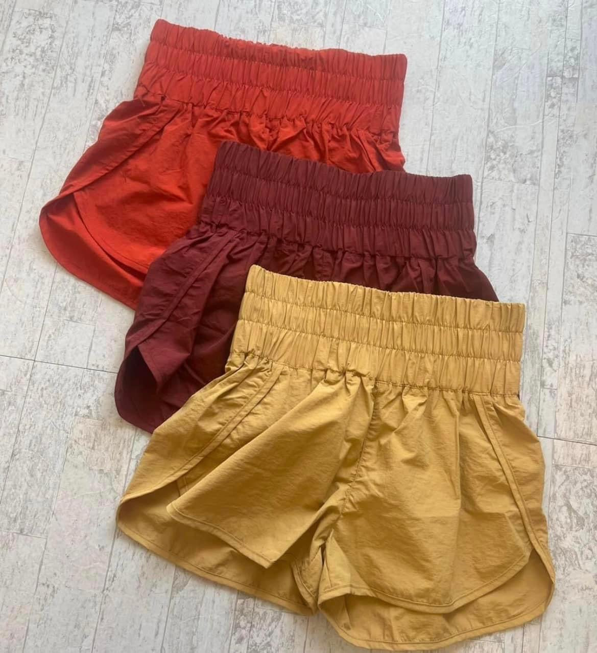 smocked windbreaker shorts, rust